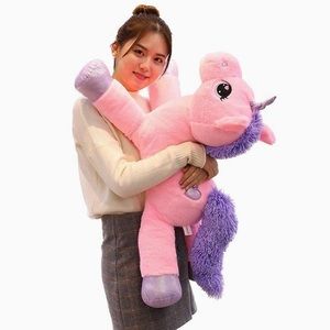 Large plush pink unicorn stuffed animal toy.